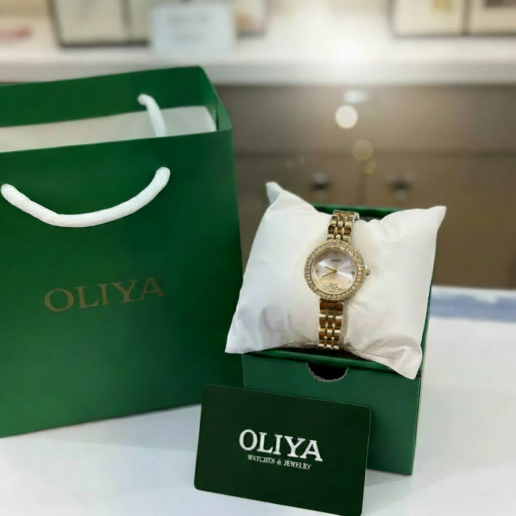 Montre OLIYA Dorée à Cadran Champagne et Cristaux Flottants – L’Élégance en Mouvement
